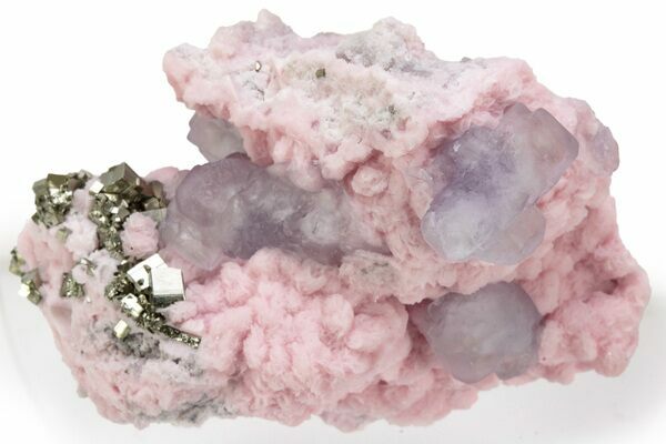 Rhodochrosite with cubic pyrite and purple fluorite from Peru.